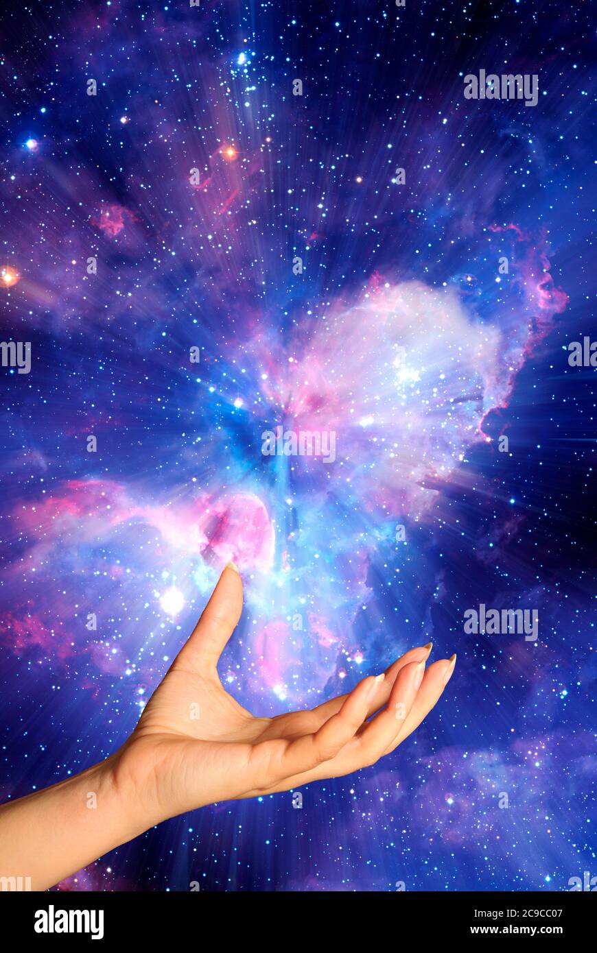 open woman hand in a gesture of acceptance with space and stars background Stock Photo