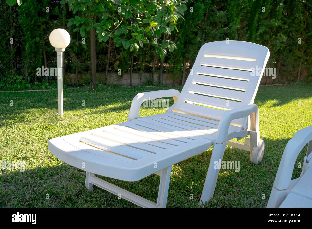 Reclining chair in garden hi-res stock photography and images - Alamy