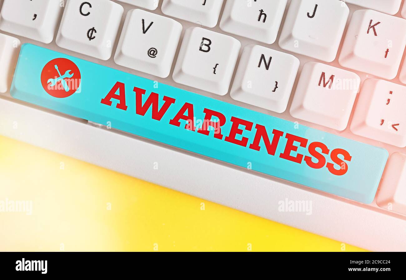 Handwriting text Awareness. Conceptual photo quality or state of being aware of knowledge and understanding Different colored keyboard key with access Stock Photo