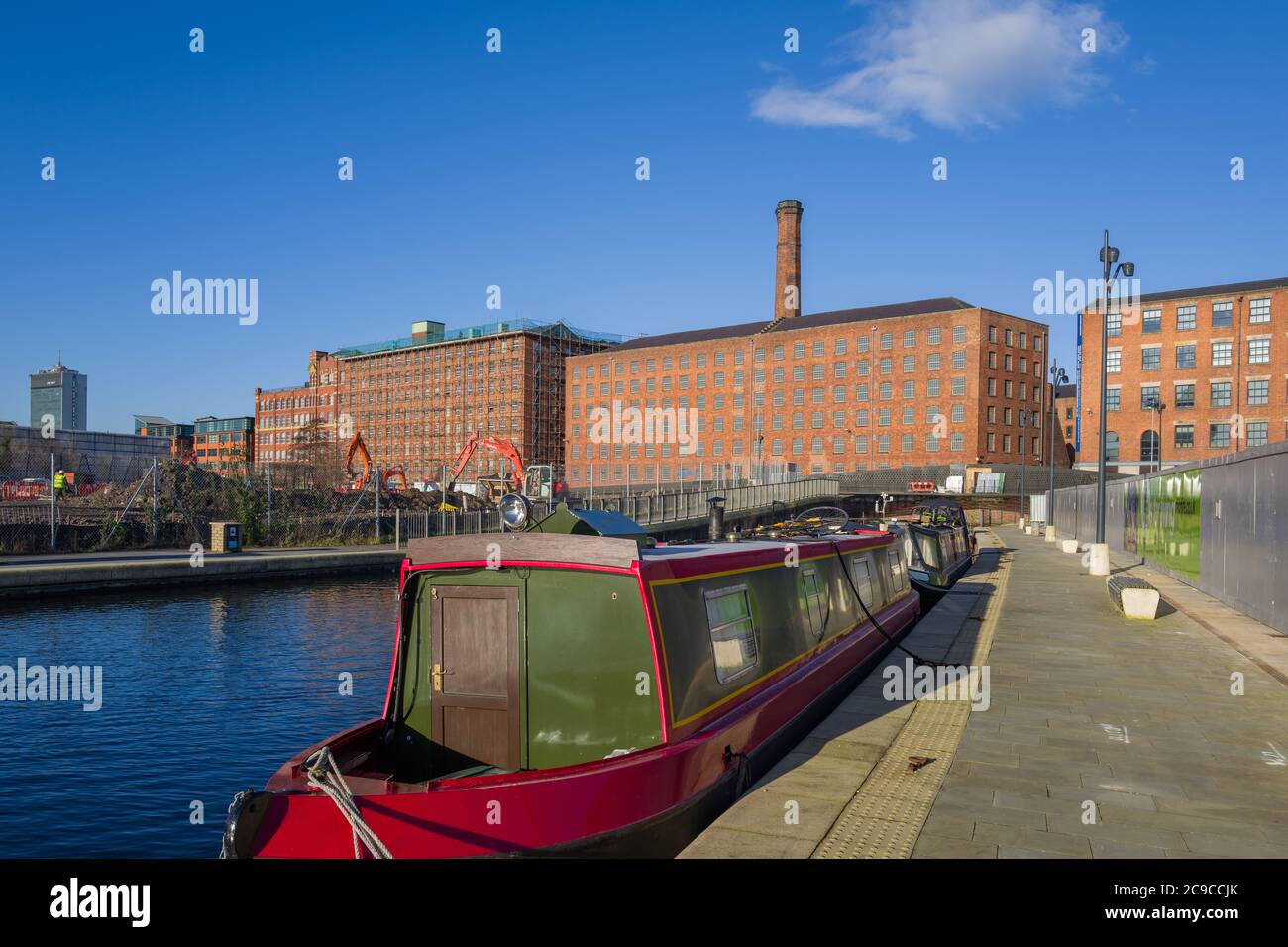 Variety of Manchester buildings - City Tower, Royal Mills, Murrays' Mills. Taken from towpath in New Islington Marina, Ancoats, Manchester. Stock Photo