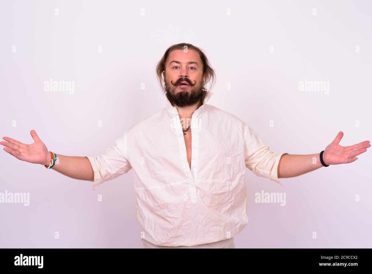 Bearded man with mustache and long hair against white background Stock Photo