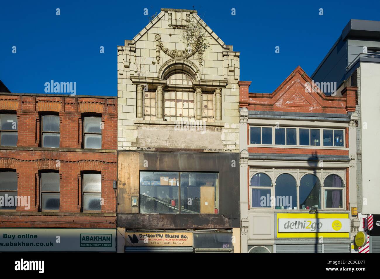 Upper storeys of various shops on Oldham Street, Manchester, UK. Building with different styles and from different eras. Stock Photo