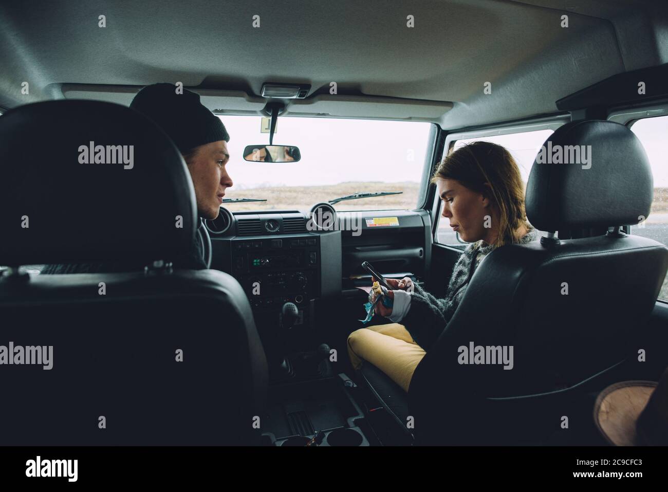 Couple making a wanderlust vacation, exploring iceland with their 4x4