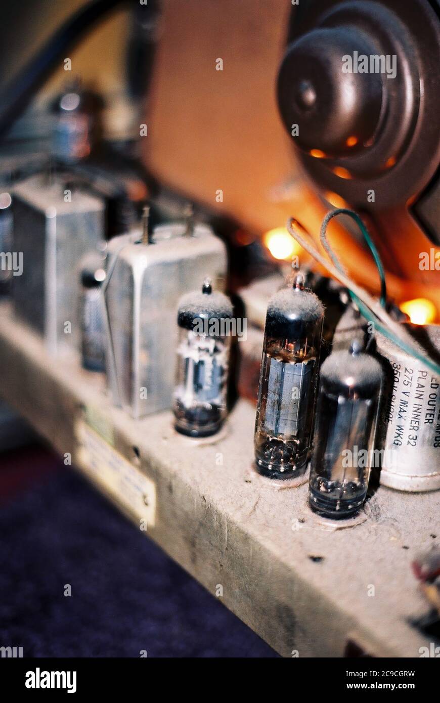 Valves or vacuum tubes in a vintage bakelite radio in operation Stock Photo