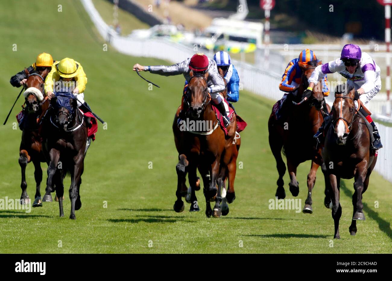 Supremacy ridden by jockey Adam Kirby (right) on their way to win the Qatar Richmond Stakes during day three of the Goodwood Festival at Goodwood Racecourse, Chichester. Stock Photo
