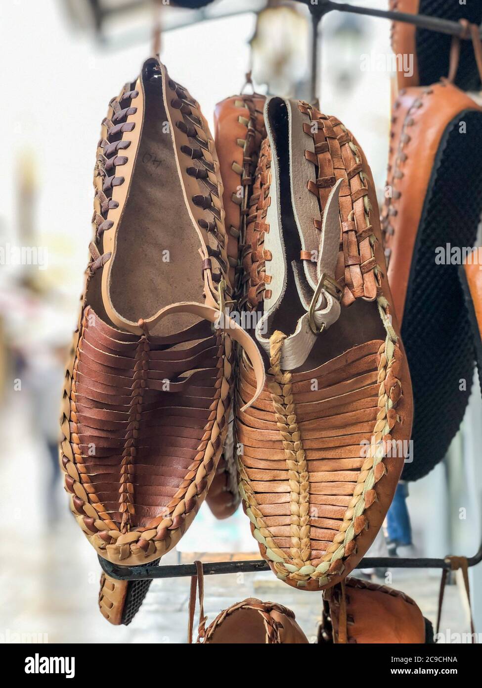 handmade leather shoes hanged in the bazaar in Turkey Stock Photo - Alamy