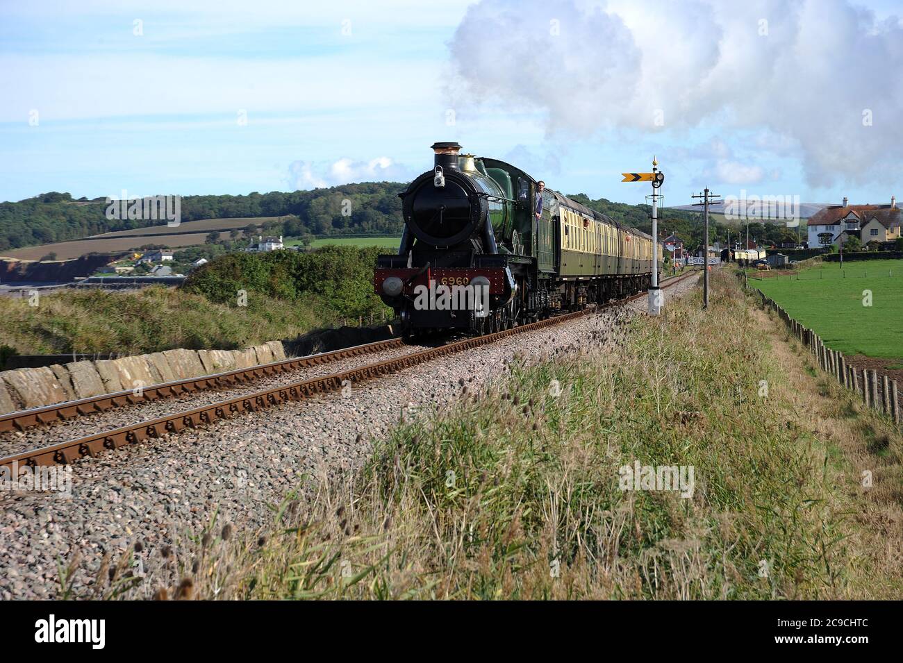 'Raveningham Hall' leaving Blue Anchor with a Bisops Lydeard - Minehead train. Stock Photo