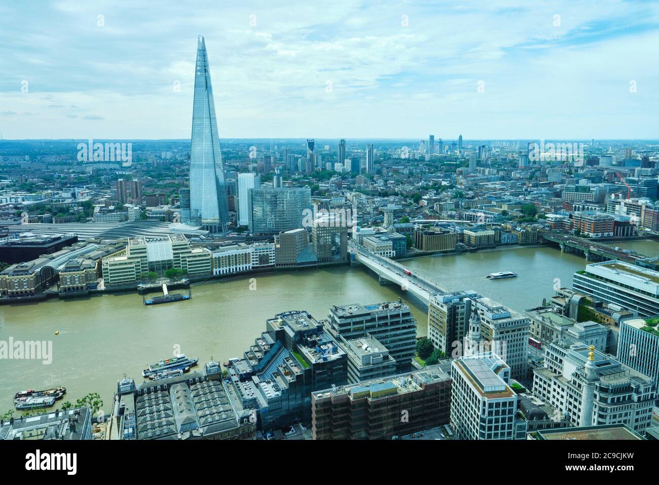 Aerial shot of London with the River Thames, Shard, London Bridge, London Bridge Station, Monument, and Southwark Bridge, etc. Stock Photo