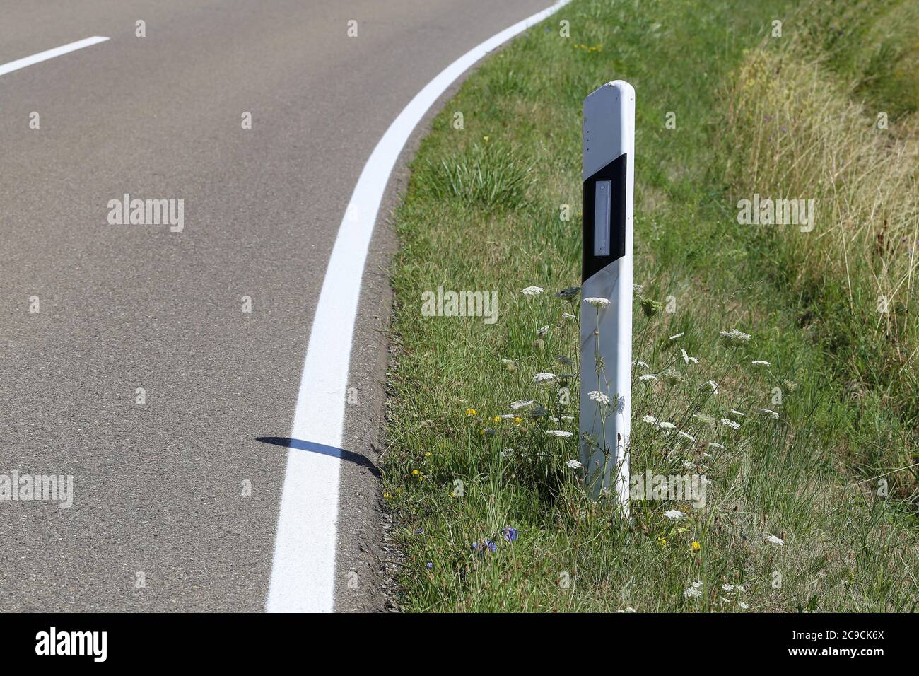 Roadside post on a country road in germany Stock Photo Alamy