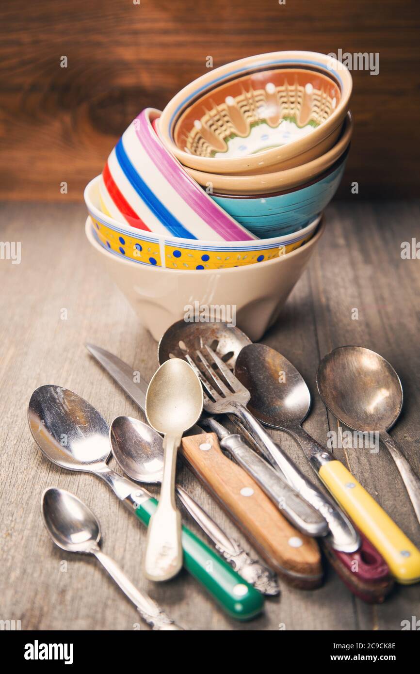 many old crockery and spoons,forks and knife in studio Stock Photo Alamy