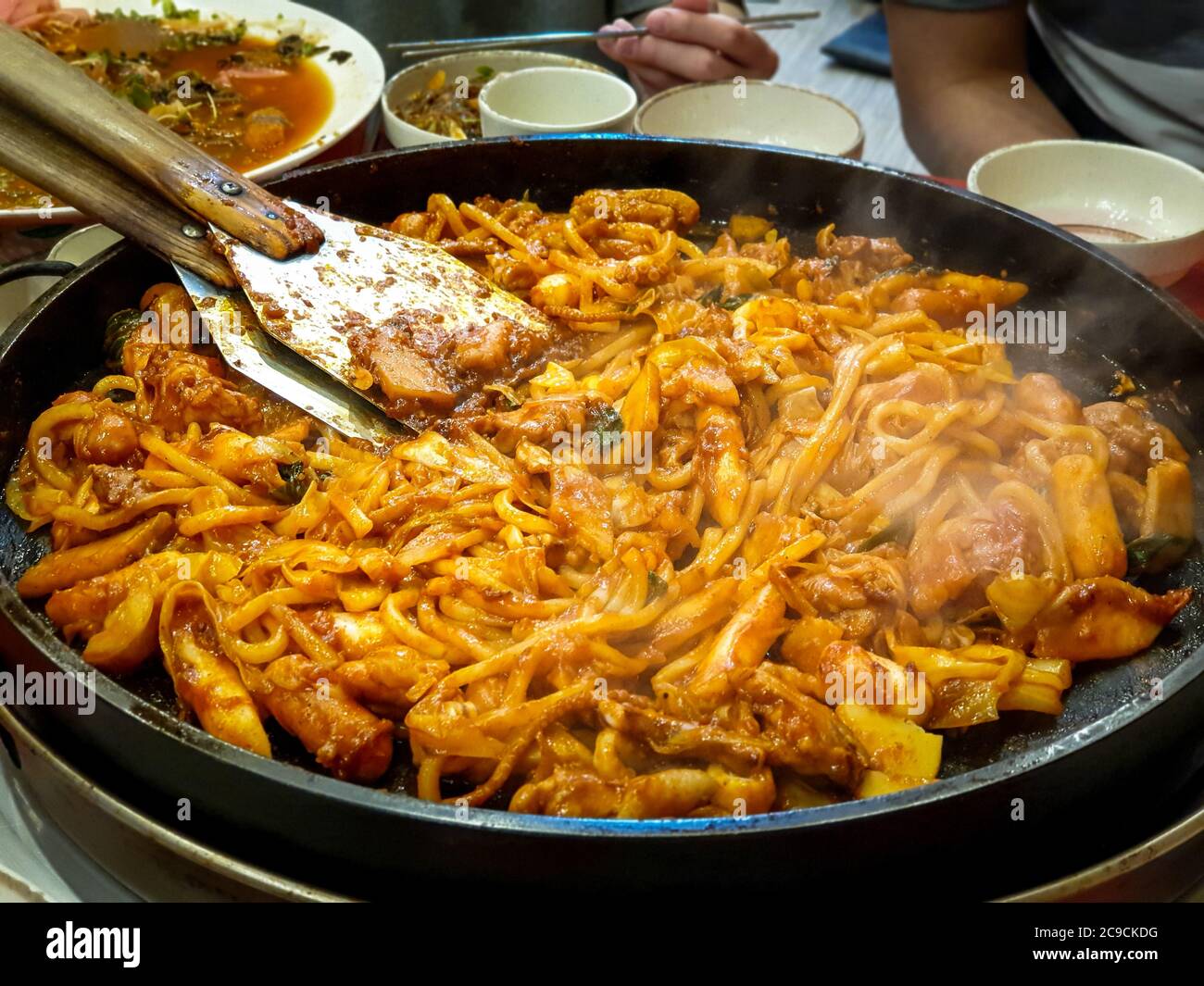 Dak-galbi, spicy stir-fried chicken rib, vegetable and noodle on grill - South Korea. Popular Korean food among foreign tourists. Stock Photo