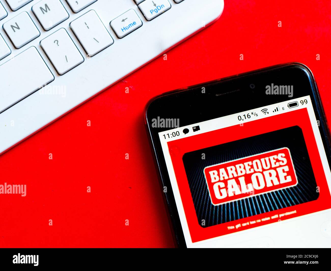 In this photo illustration a Barbeques Galore logo is seen displayed on