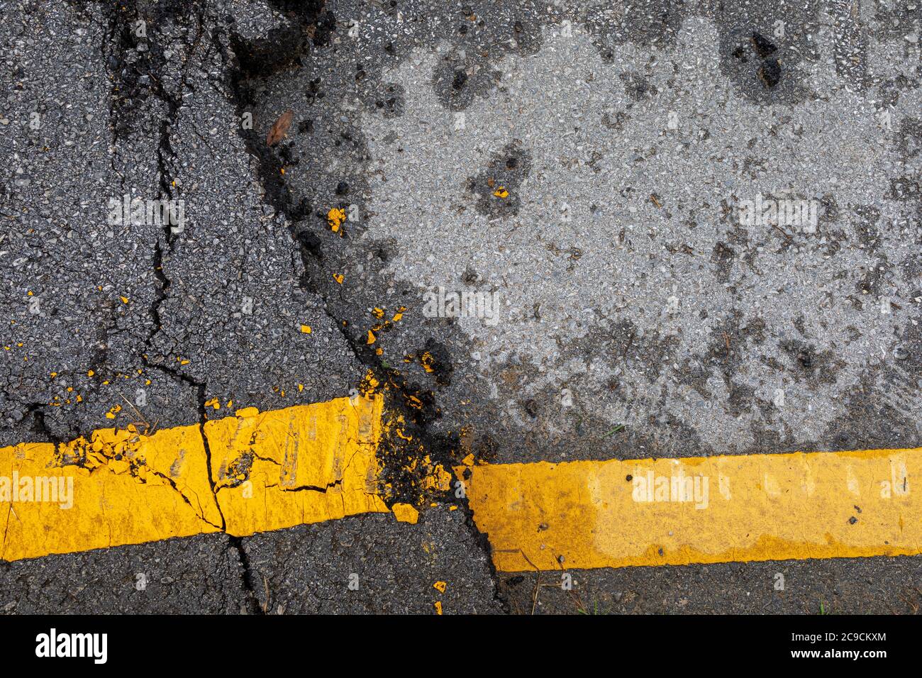 cracked asphalt background and texture Stock Photo