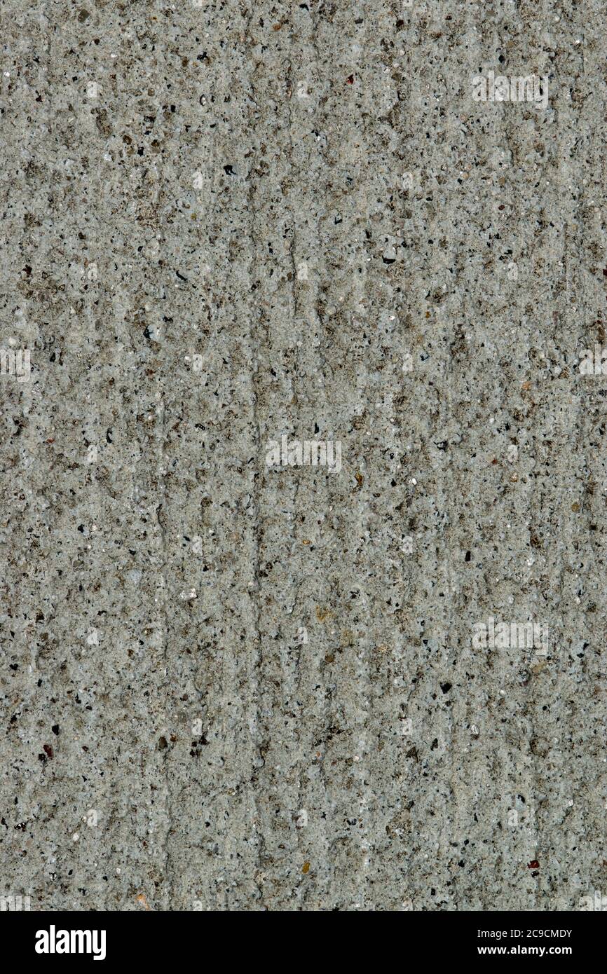 Gritty cement texture background wallpaper in vertical format, full frame image. Macro details and room for text. Stock Photo
