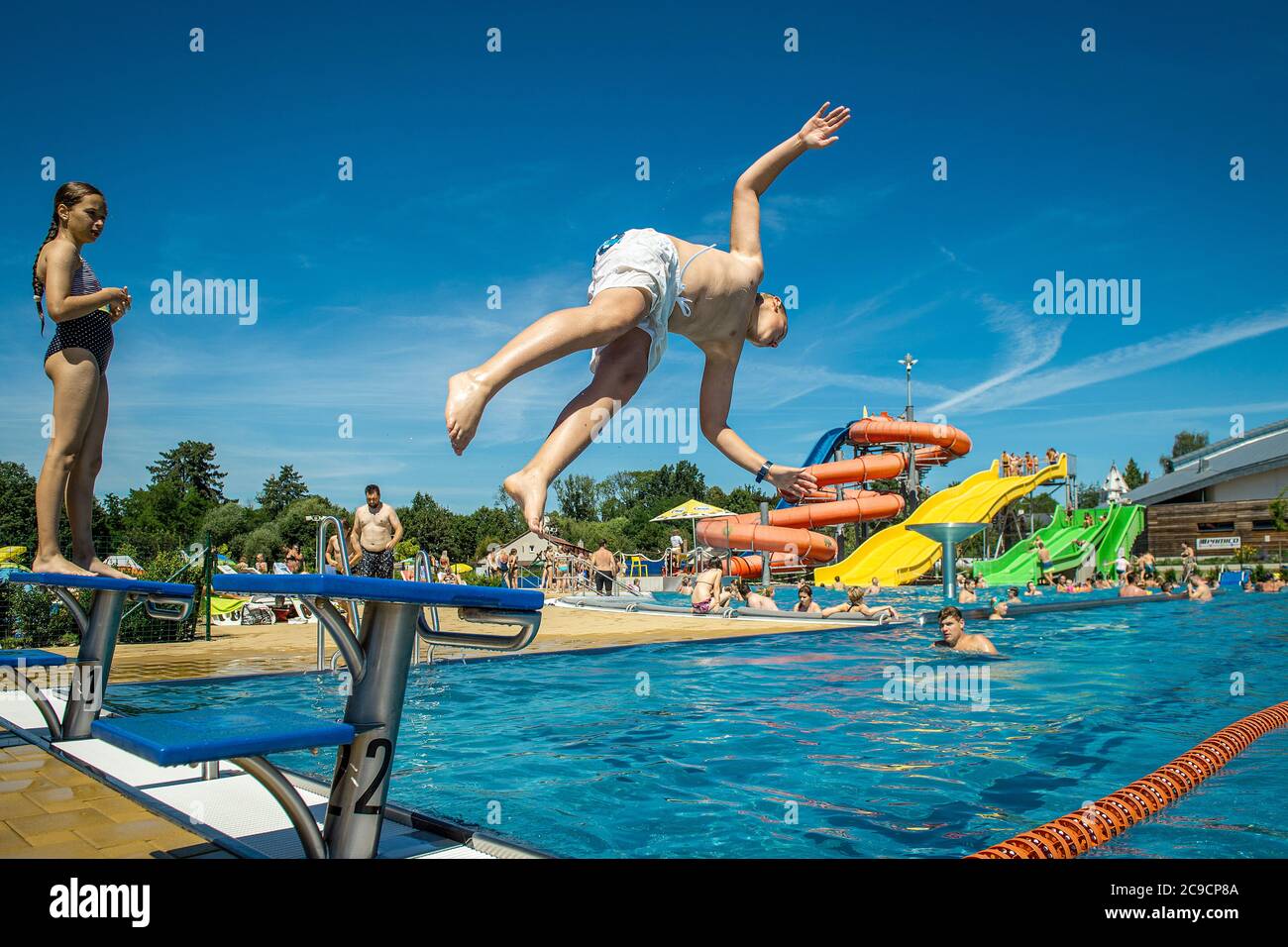 Turnov, Czech Republic. 30th July, 2020. People enjoy hot weather in  swimming pool aquapark Maskova zahrada in Turnov, Czech Republic, July 30,  2020. Credit: Radek Petrasek/CTK Photo/Alamy Live News Stock Photo - Alamy