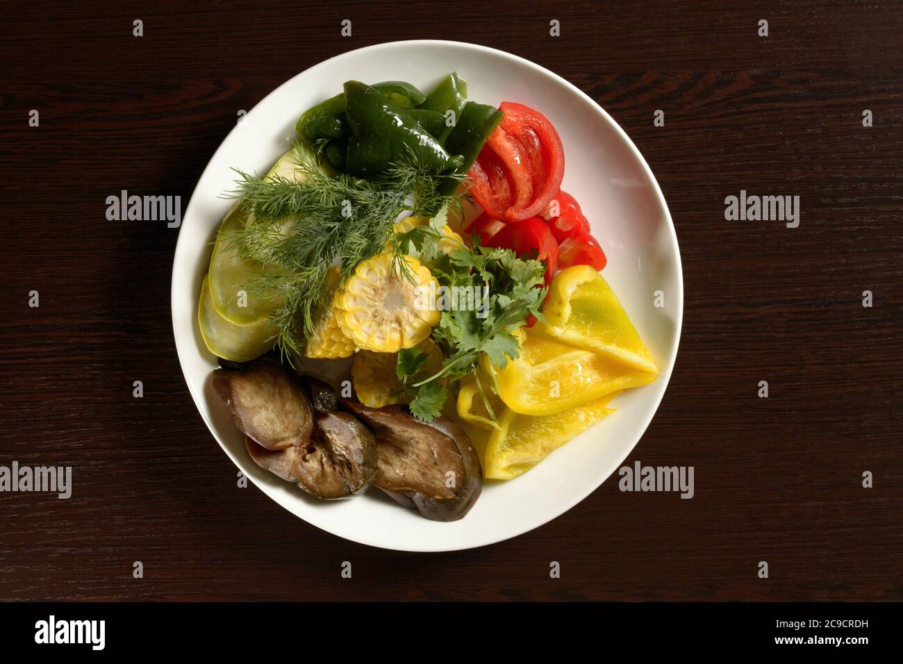 Sliced raw vegetables on a plate top view. Photos for restaurant and cafe menus Stock Photo