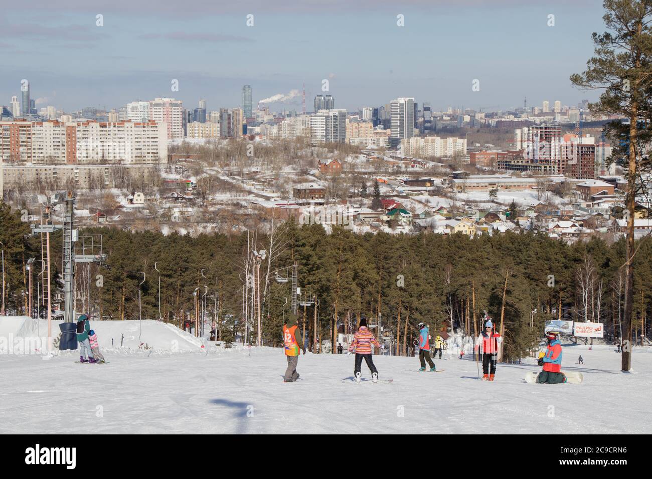 Yekaterinburg, Russia - February 26, 2019. Training slope of sports complex on Uktus Mountain. Instructors teach beginners how to ski or snowboard. In Stock Photo