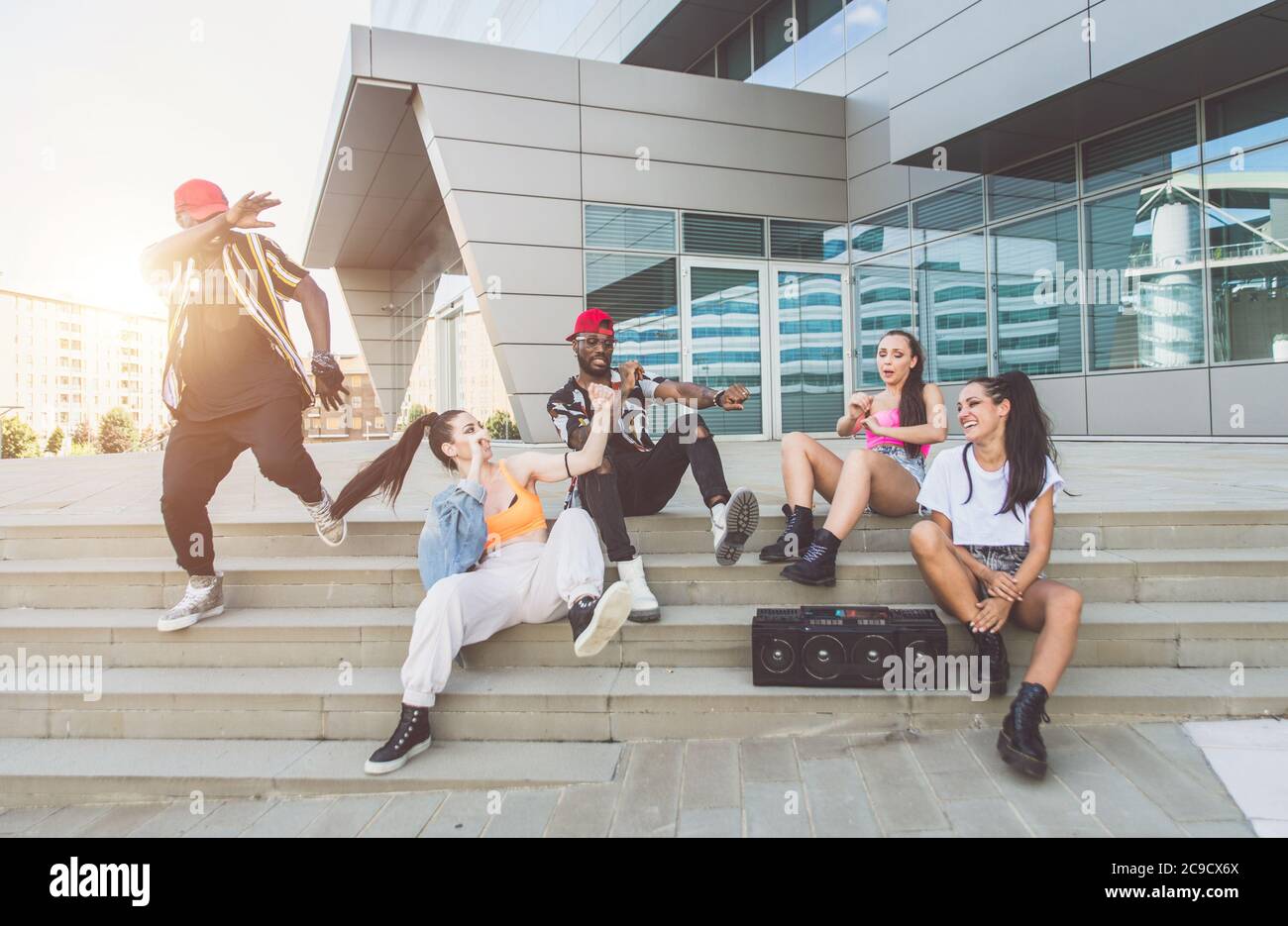 Group of hip hop dancers permorming their dance. Crew making show in an ...