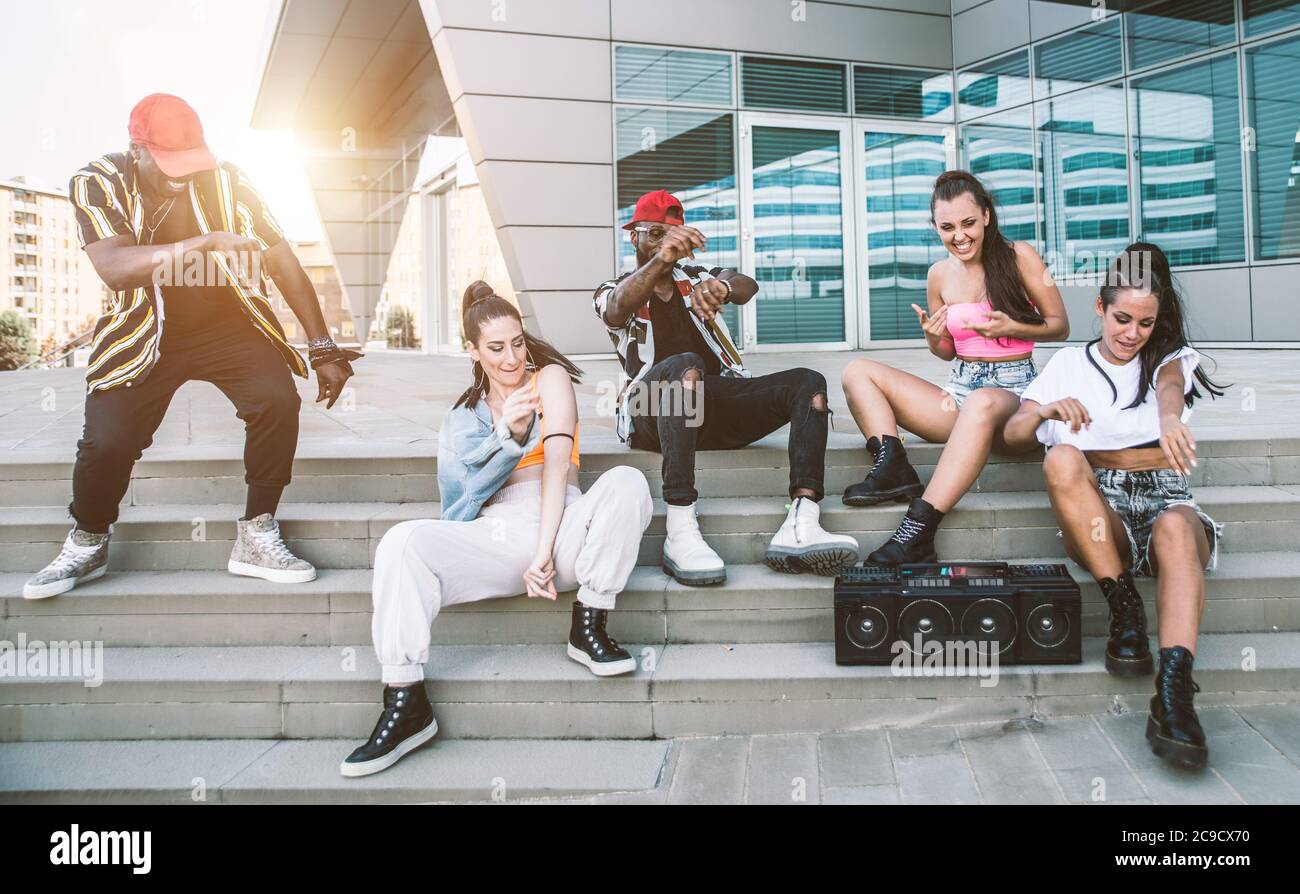 Group of hip hop dancers permorming their dance. Crew making show in an ...
