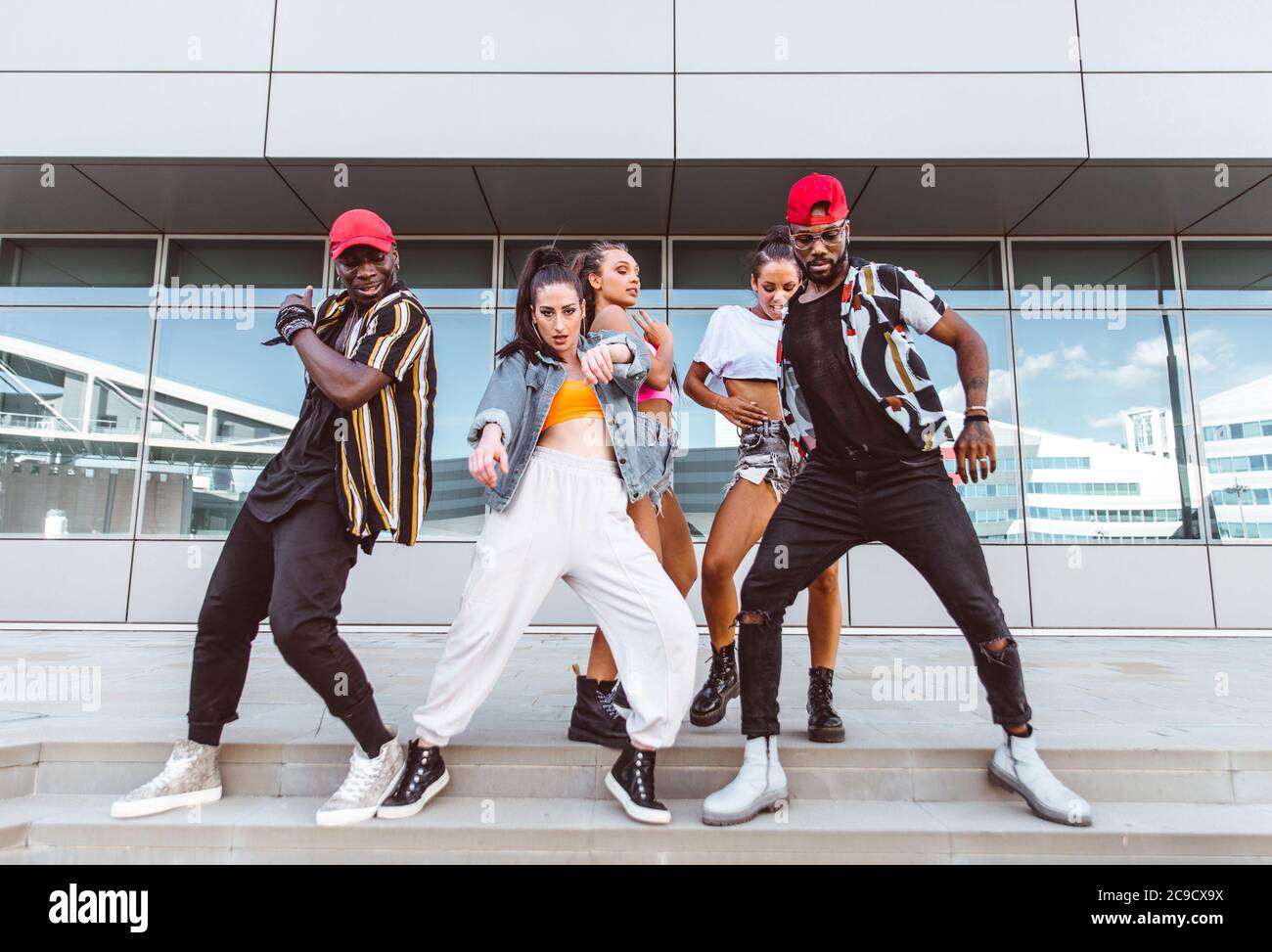 Group of hip hop dancers permorming their dance. Crew making show in an ...