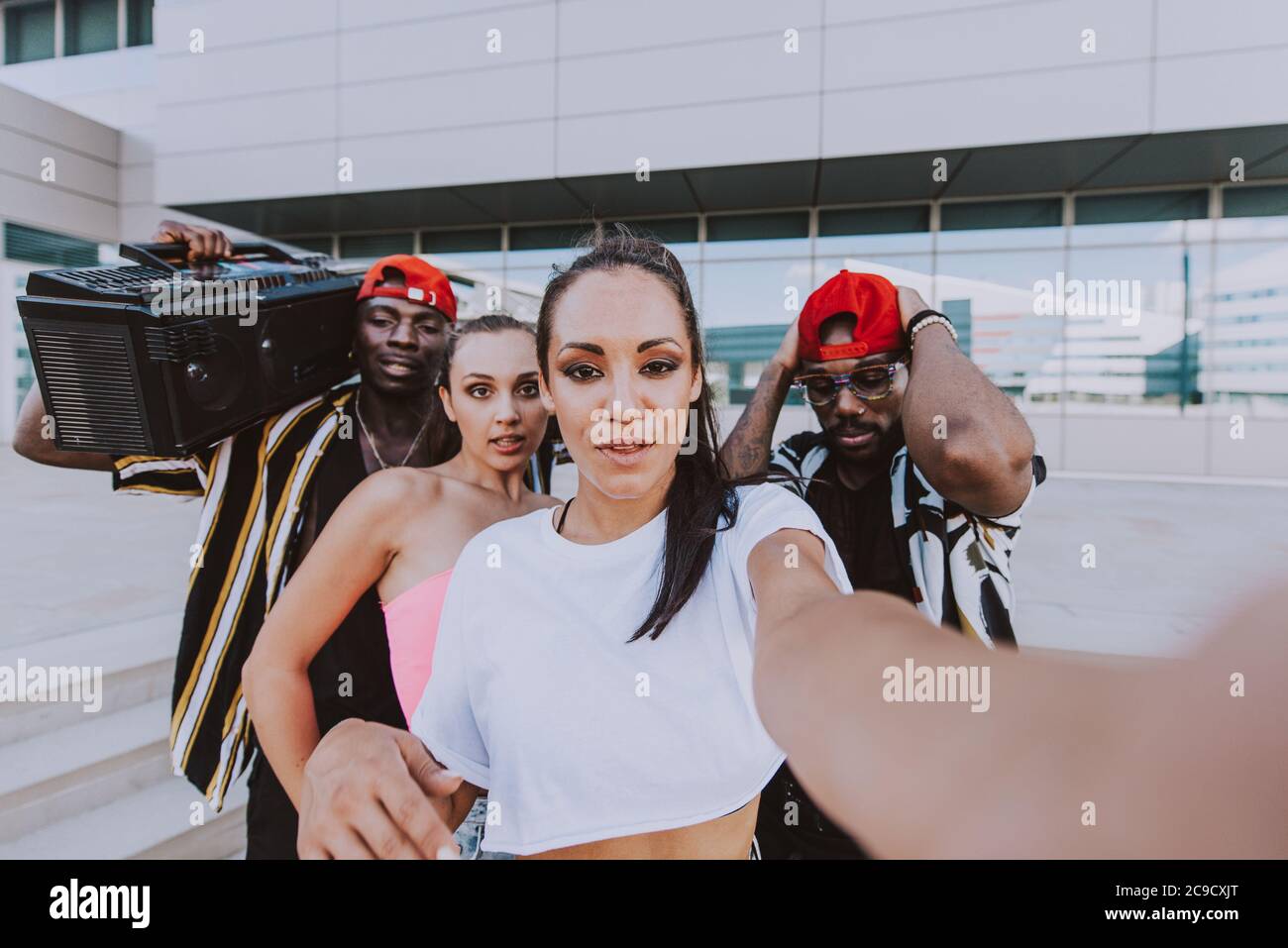 Group of hip hop dancers taking a break and shooting selfies Stock Photo