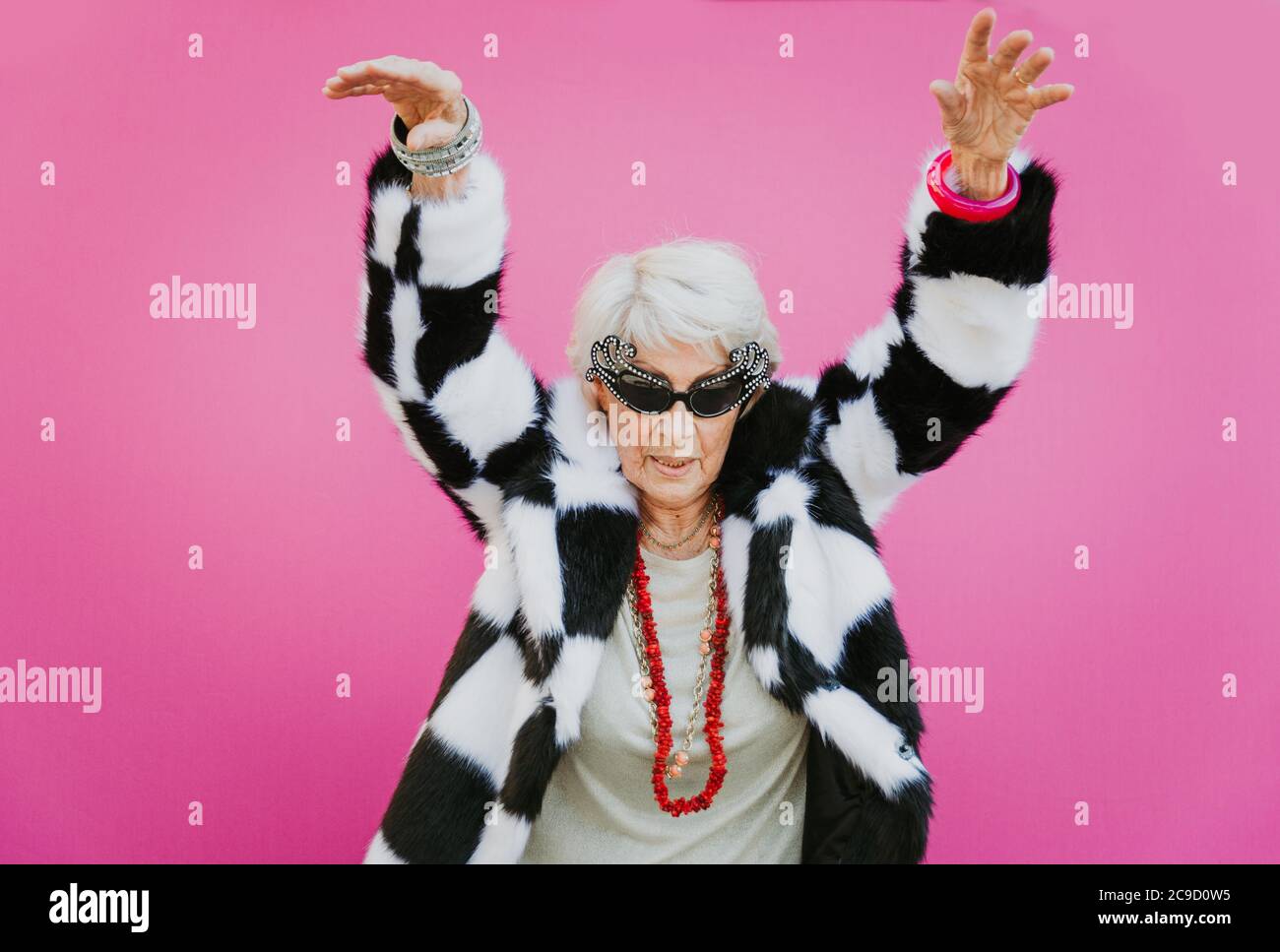 Funny Grandmother Dancing On Colored Background Stock Photo Alamy