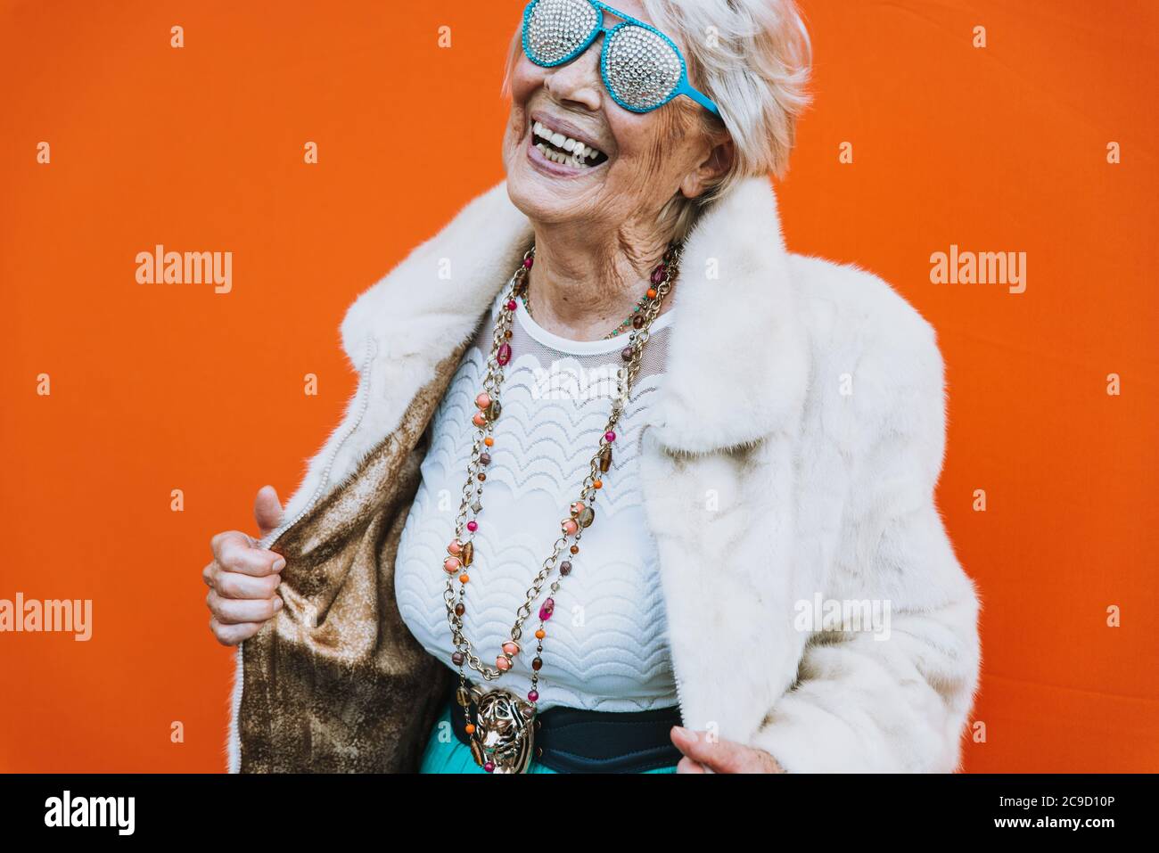 Funny Grandmother Dancing On Colored Background Stock Photo Alamy