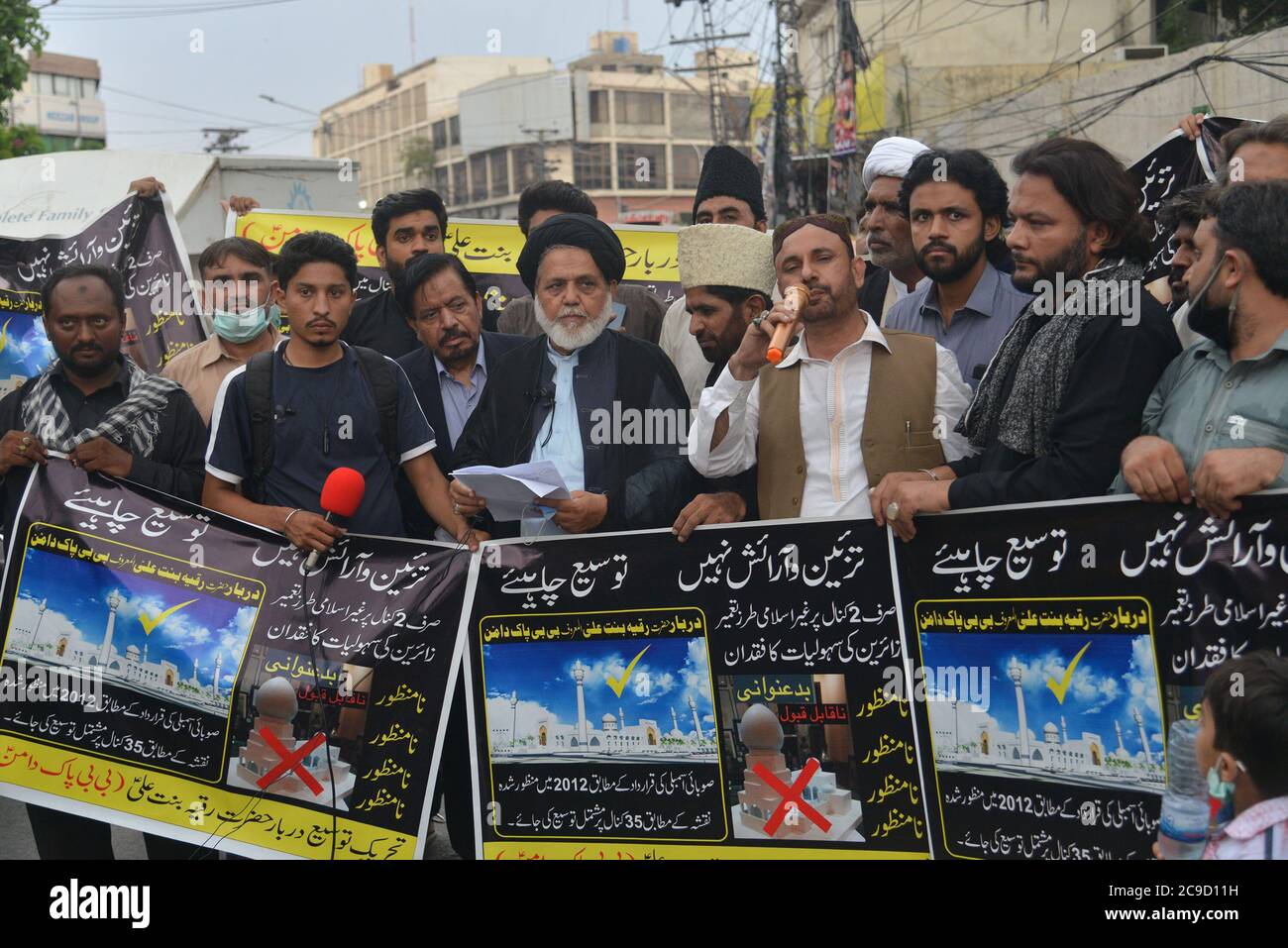 Lahore, Pakistan. 29th July, 2020. Pakistani activists of Tehreek-e-Tausee Darbar Hazrat Ruqiyya Binte Ali (A.S) are holding protest demonstration for acceptance of their demands outside Press Club in provincial capital city Lahore. Bibi Pak Daman is the mausoleum of Hazrat Ruqiyya Binte Ali (A.S) located in Lahore. Legend has it that it holds the graves of six ladies from Muhammad's household (Ahl Al-Bayt). (Photo by Rana Sajid Hussain/Pacific Press/Sipa USA) Credit: Sipa USA/Alamy Live News Stock Photo
