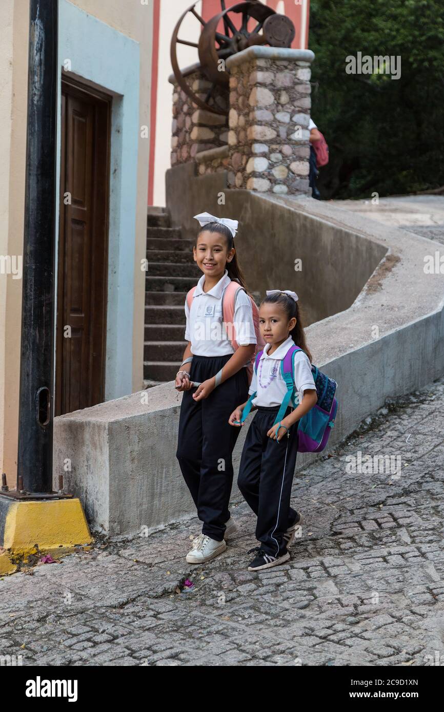 Batopilas, Chihuahua, Mexico. Young Girls Going to School. Stock Photo