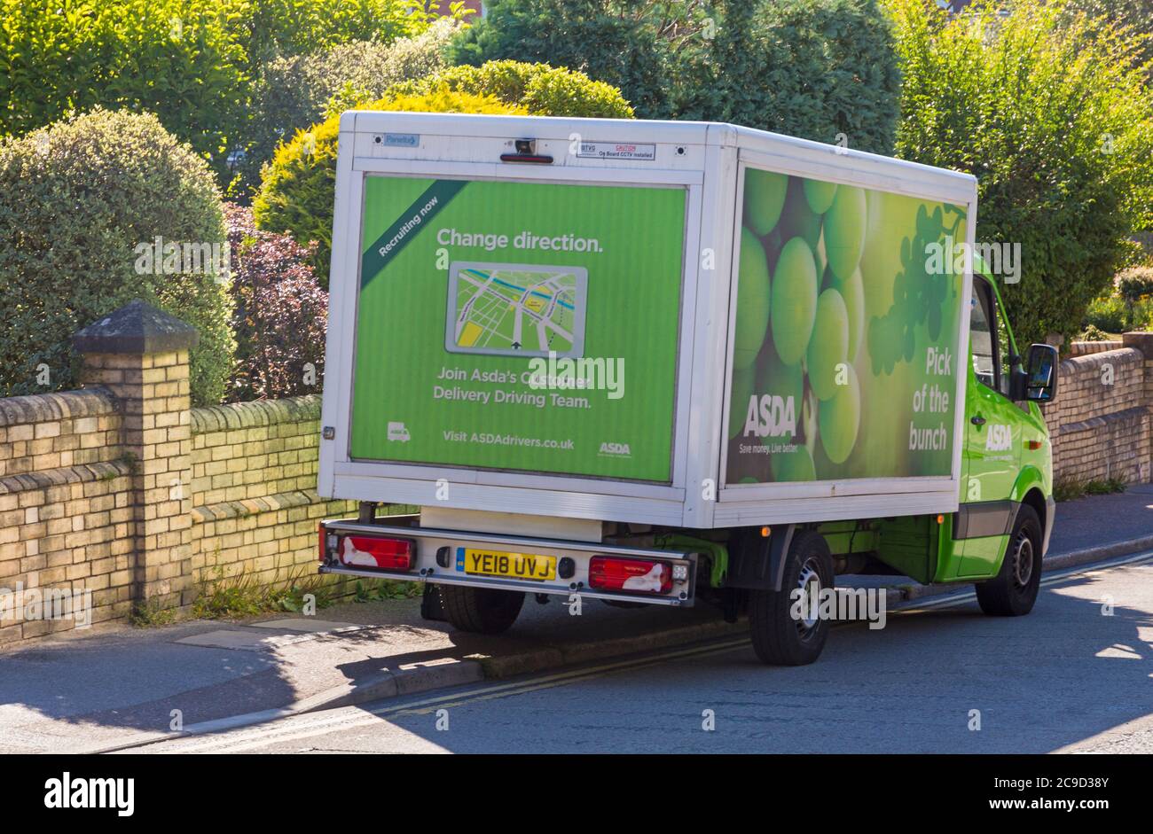 Asda van, Asda delivery van, stopped in street to deliver home groceries at Bournemouth, Dorset UK in July - Asda lorry, Asda truck in road Stock Photo