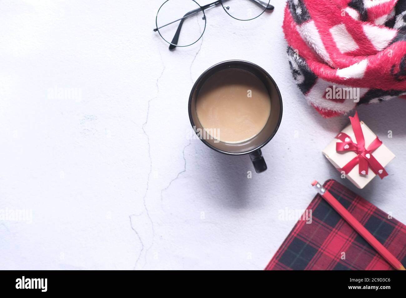 flat composition coffee, notepad and eyeglass on white background . Stock Photo
