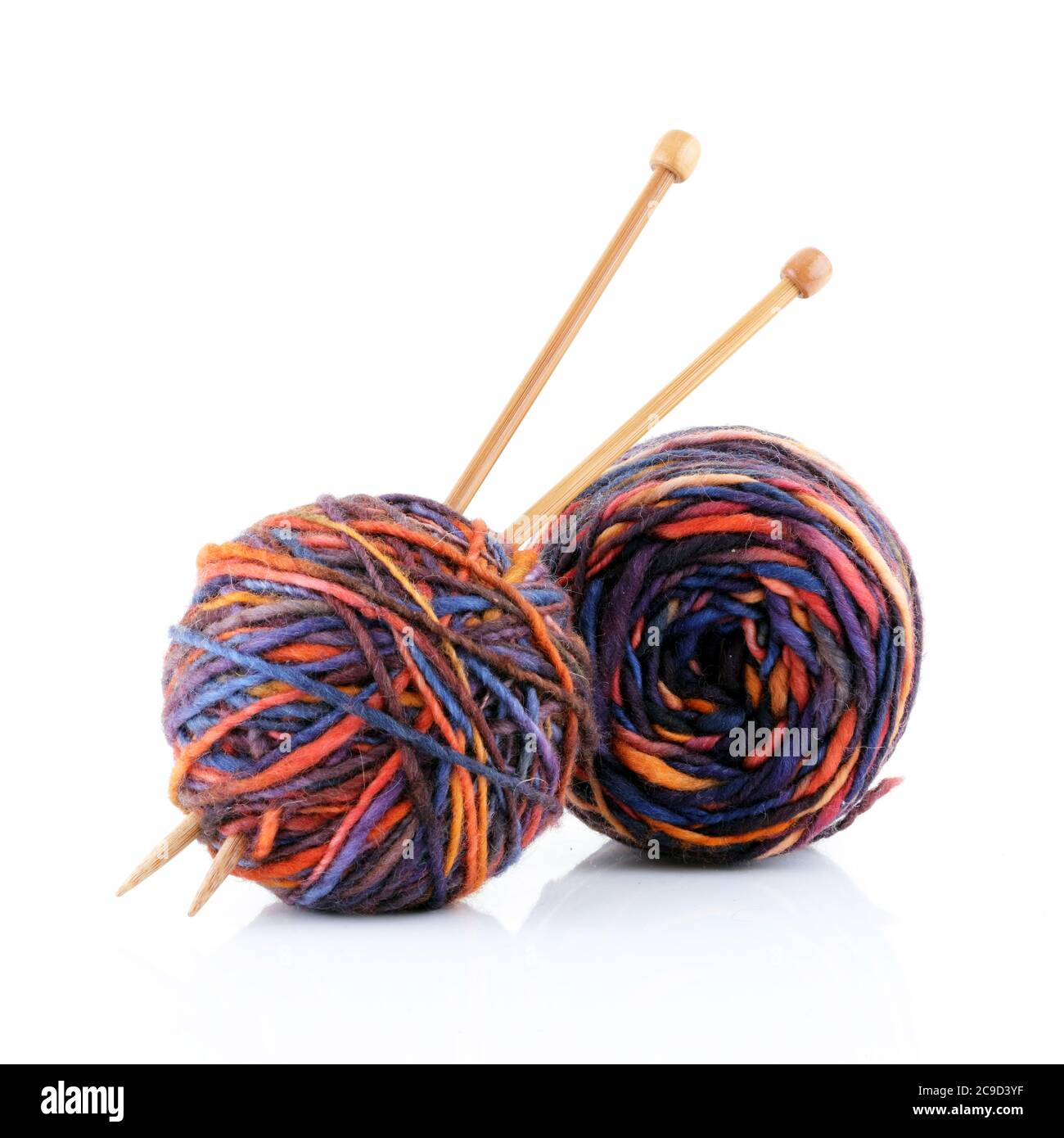 Two balls of wool with knitting needles Stock Photo