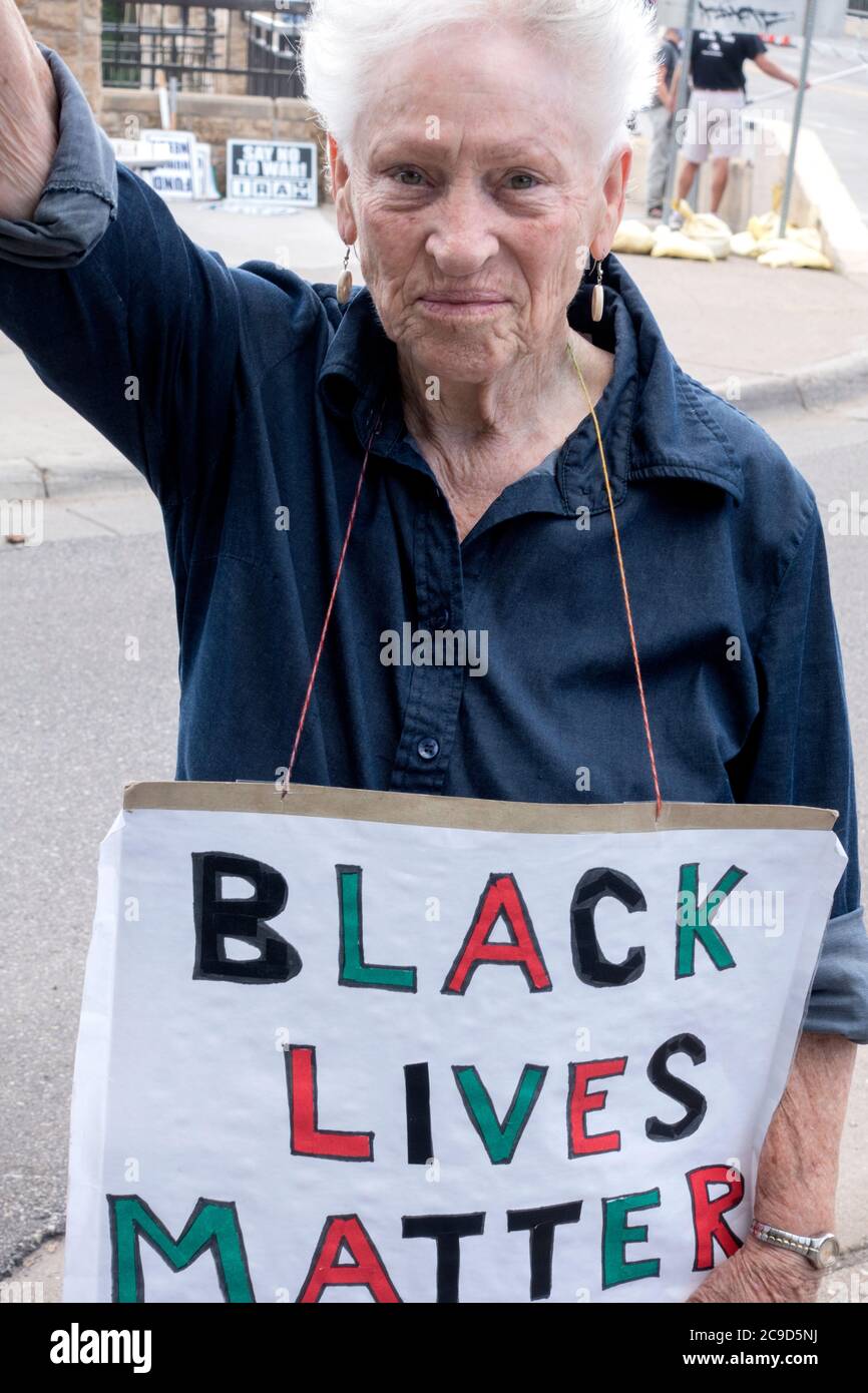 Proud 88 year old woman Carrying a 'Black Live Matters' poster protesting on the Lake Street Bridge.  St Paul Minnesota MN USA Stock Photo