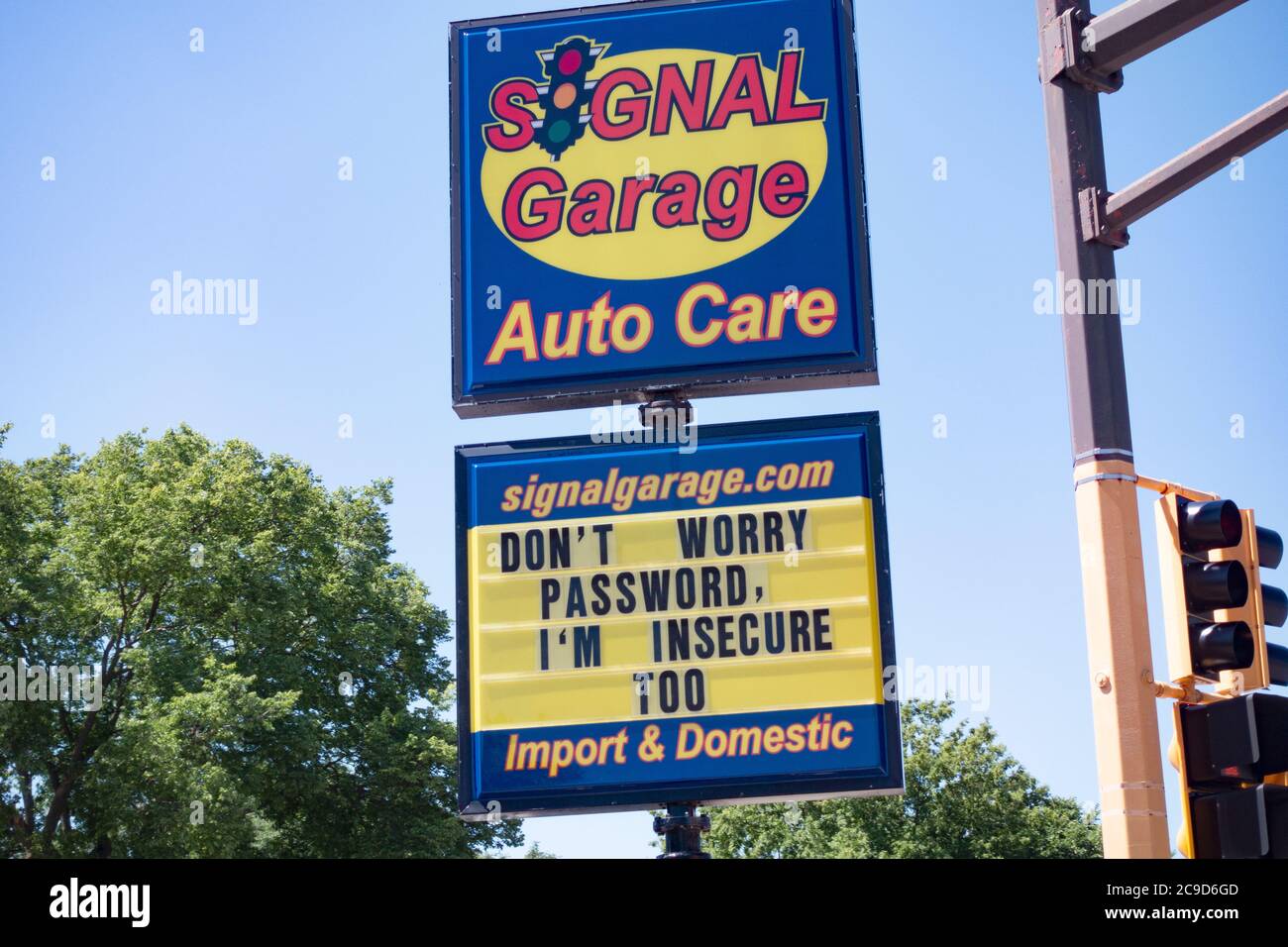 Car repair garage with a humorous saying on an advertising board 'Don't worry password, i'm insecure too'. St Paul Minnesota MN USA Stock Photo