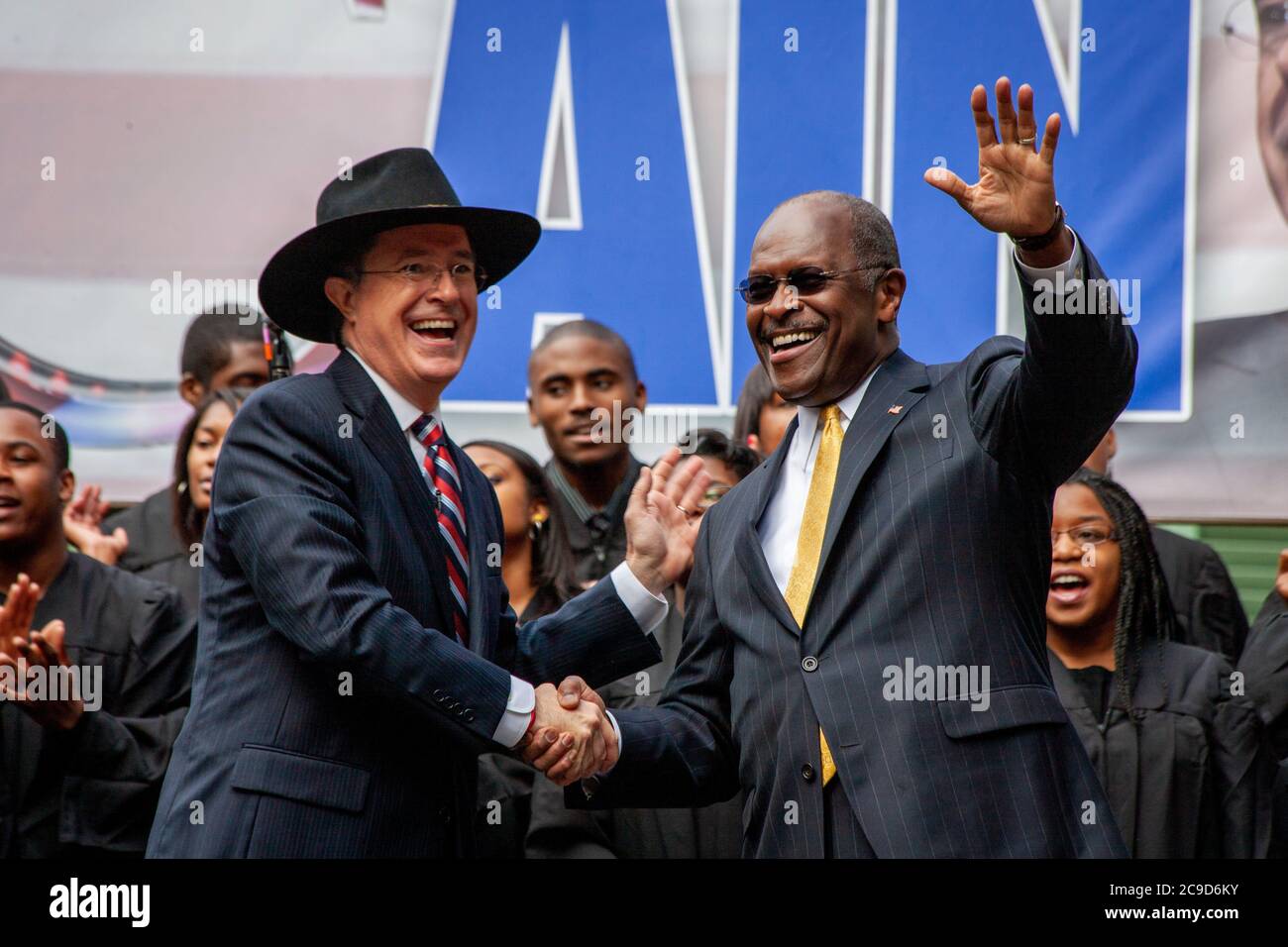 Comedian and host of the Colbert Report, Stephen Colbert, join force with the Republican Presidential Candidate Herman Cain at a rally in Charleston, SC. The event had everything a real campaign should have; Cheerleaders, marching band, gospel choir and thousands of young fans. Stock Photo