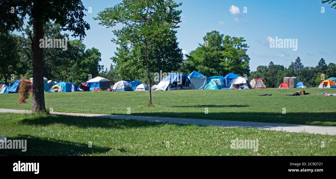 Homeless living in hundreds of tents at Powderhorn Park. Minneapolis Minnesota MN USA Stock Photo