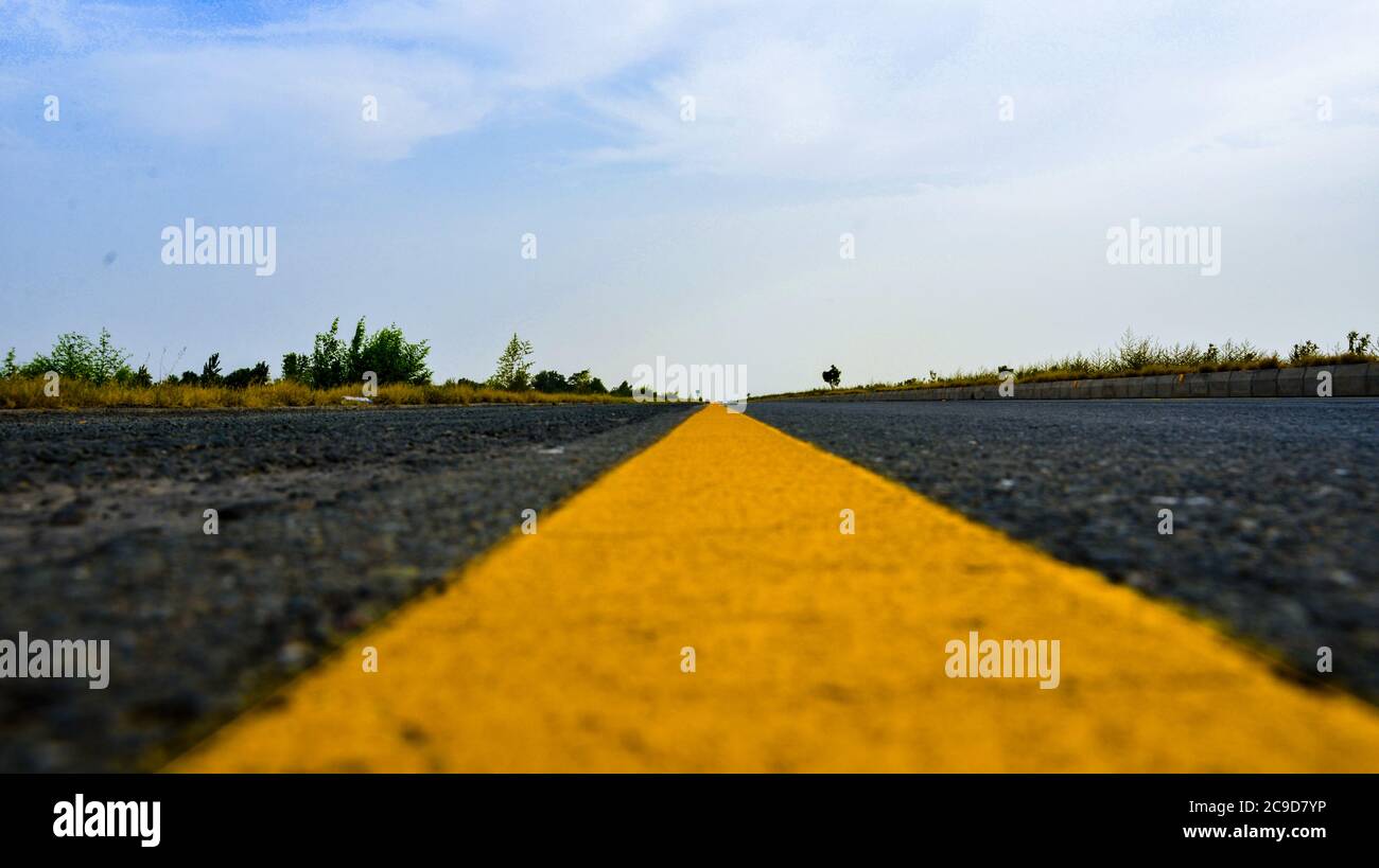 Road Yellow Line on Highway. Highway Abstract Background Stock Photo