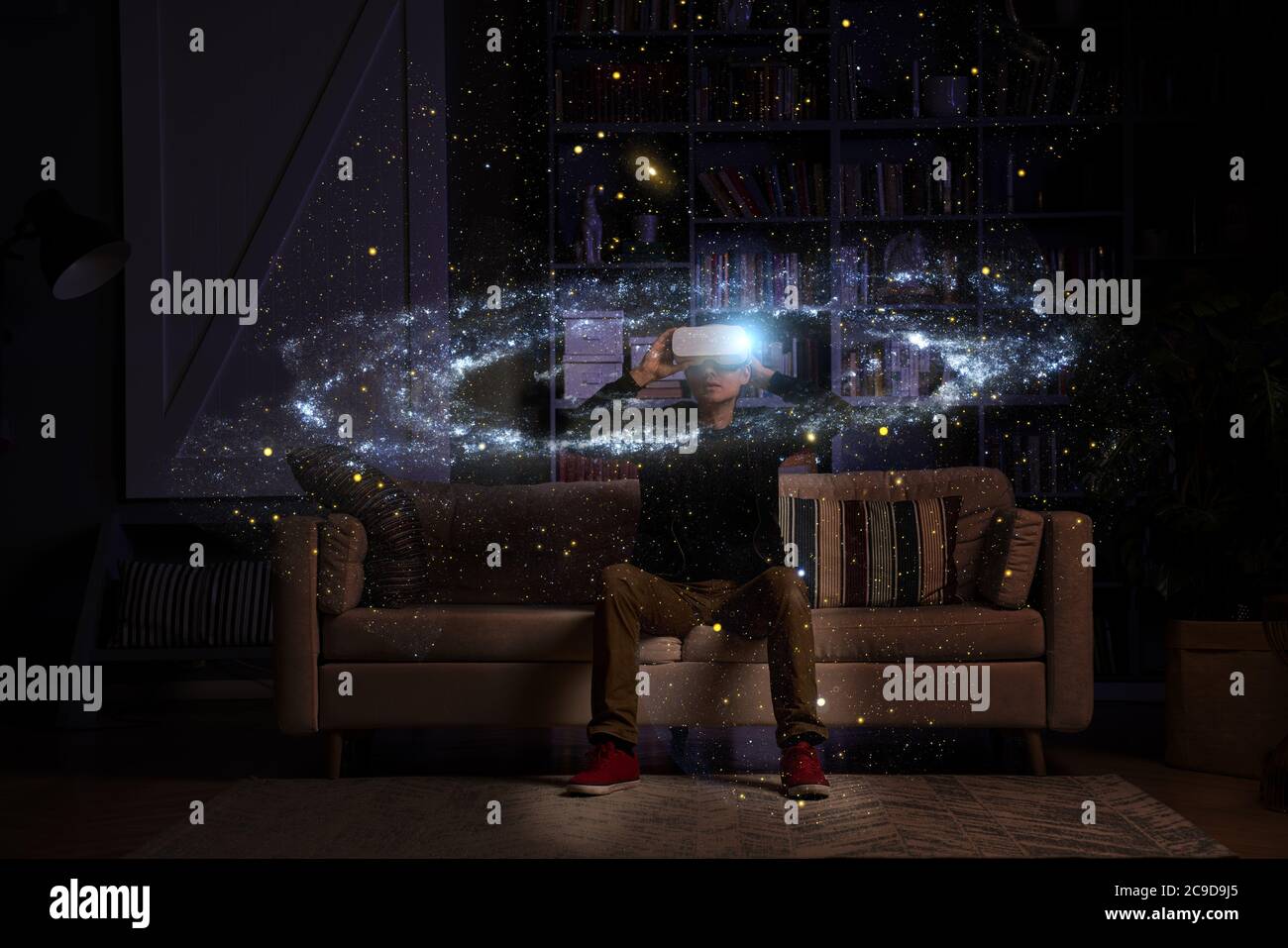 Man uses virtual reality glasses to see the galaxy space. Elements of this image furnished by NASA. Stock Photo
