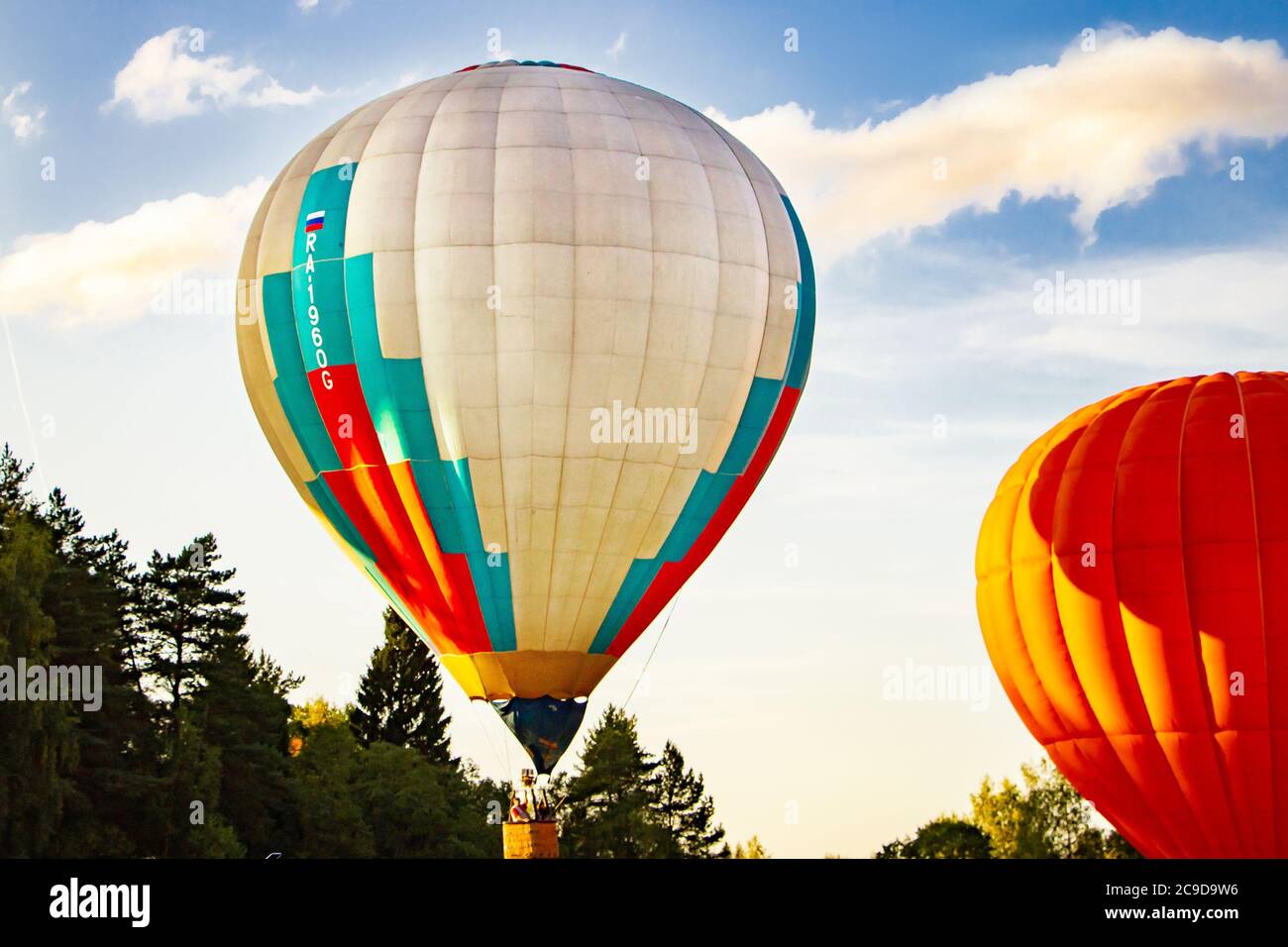 Colored hot air balloons in the blue sky Stock Photo - Alamy