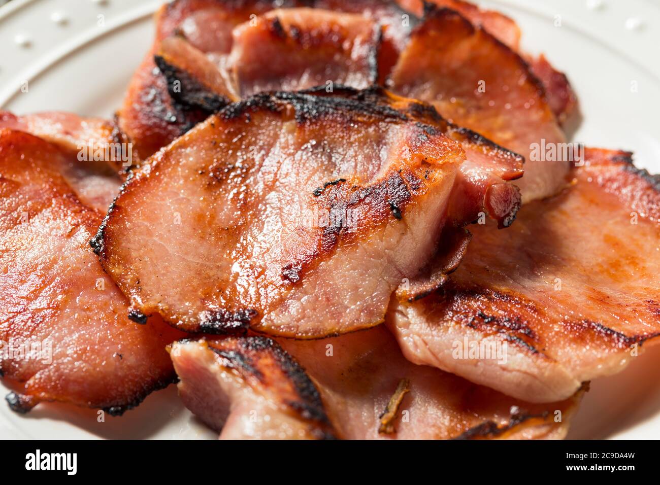 Homemade Cooked Canadian Bacon to Eat for Breakfast Stock Photo