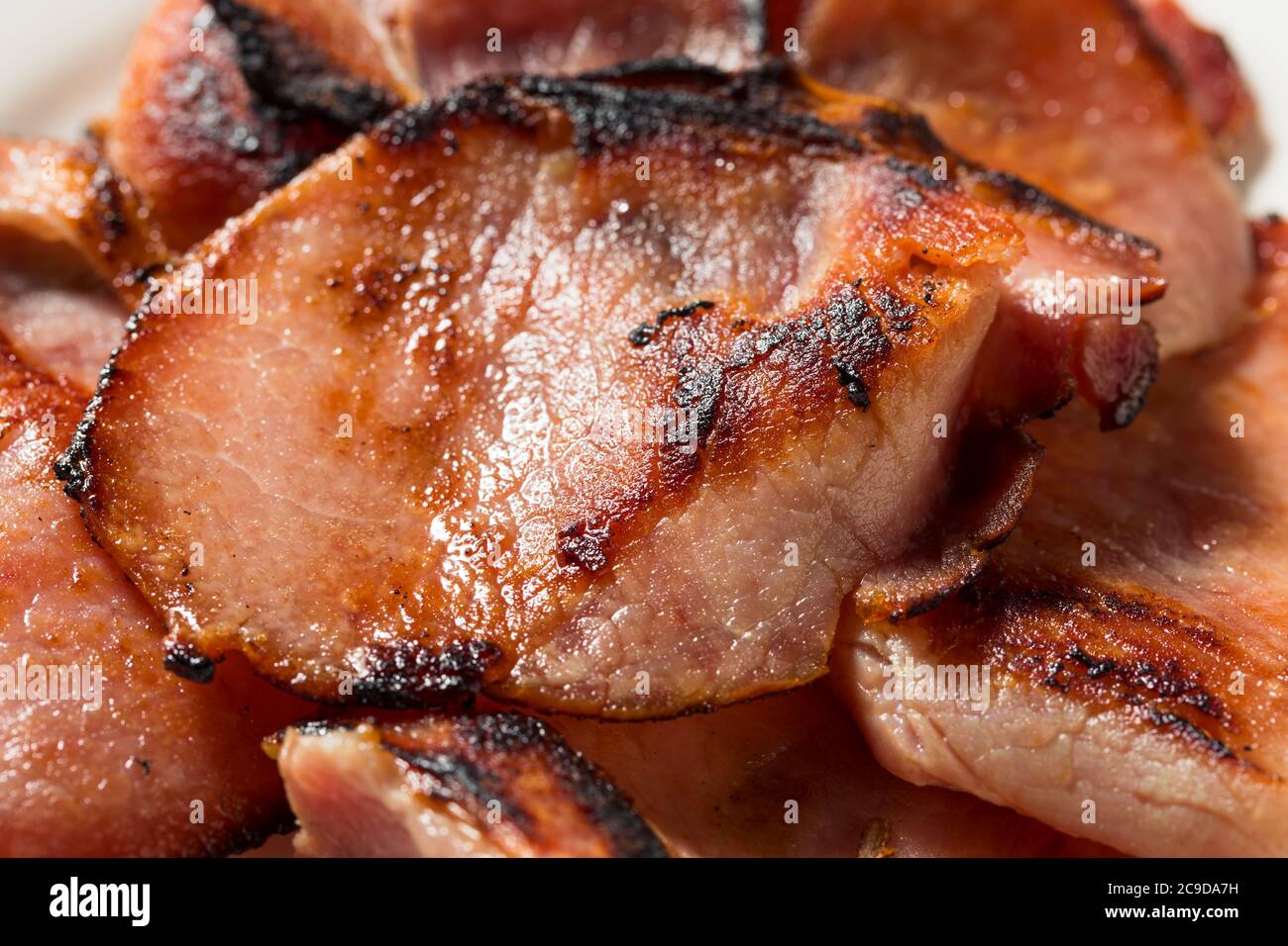 Homemade Cooked Canadian Bacon to Eat for Breakfast Stock Photo