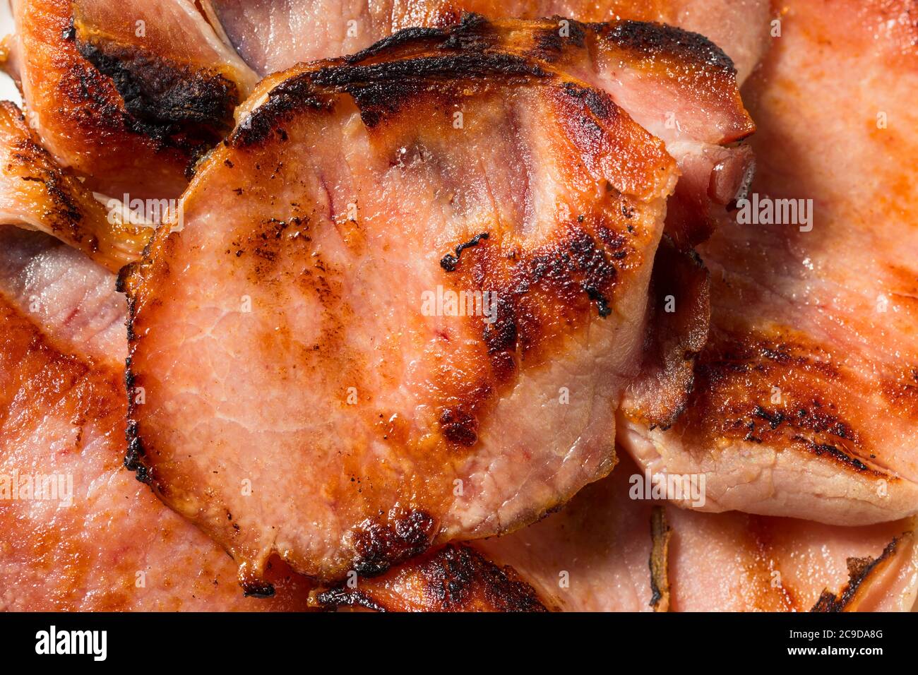 Homemade Cooked Canadian Bacon to Eat for Breakfast Stock Photo