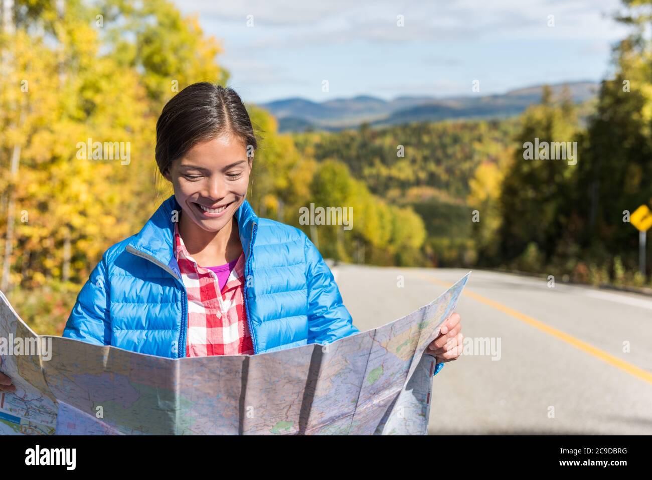 Travel Directions By Road Asian Woman Looking At Map Directions On Road Trip Stock Photo - Alamy