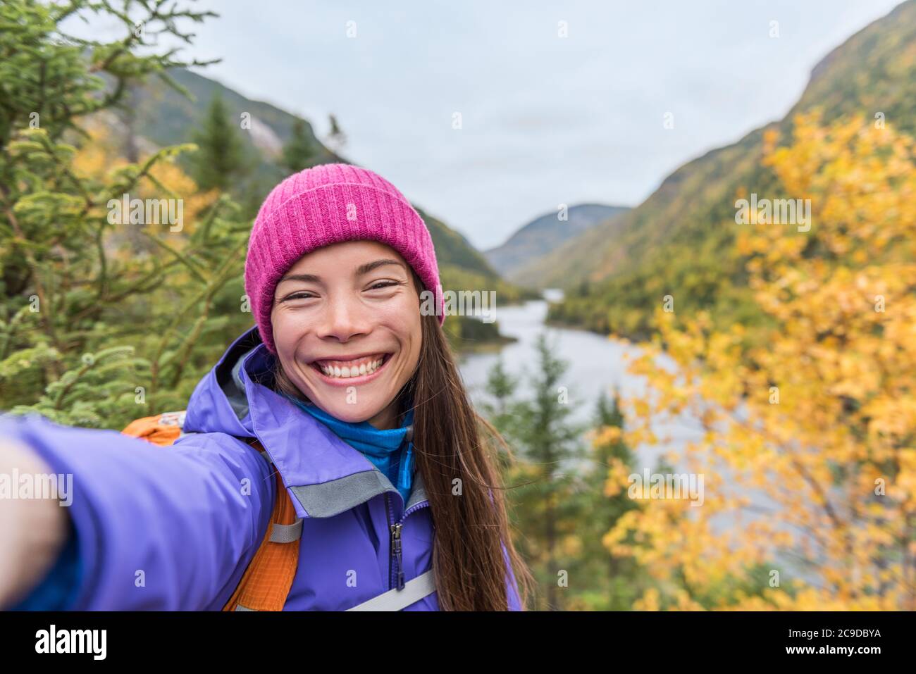 Selfie asian girl hiking in autumn nature mountains. Happy hiker woman ...