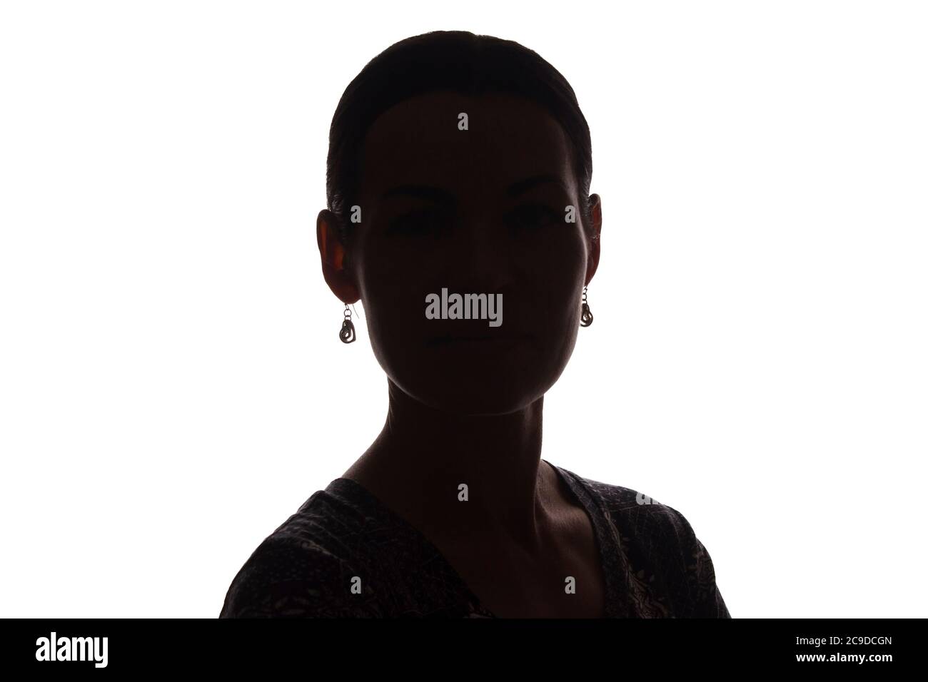 Young woman look ahead with lock of hair - isolated silhouette of a front view Stock Photo