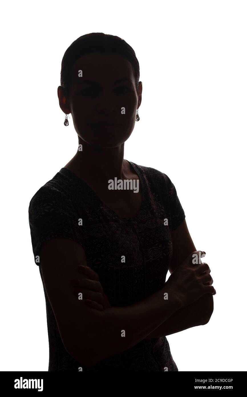 Young woman look ahead with lock of hair - isolated silhouette of a front view Stock Photo