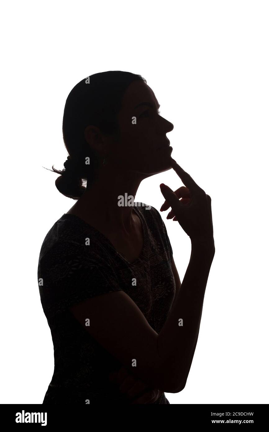 Portrait of a young woman, pensive, thinking side view - silhouette, isolated Stock Photo