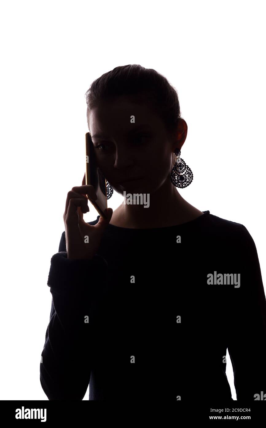 Young woman phone call - silhouette, isolate Stock Photo