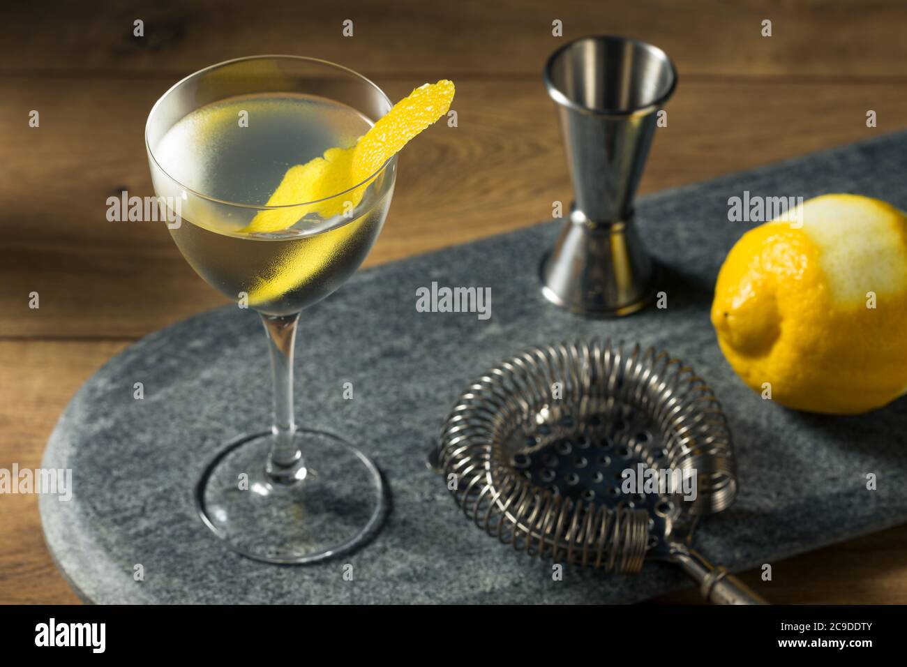 Boozy Dry Vesper Martini Cocktail with a Lemon Peel Stock Photo Alamy