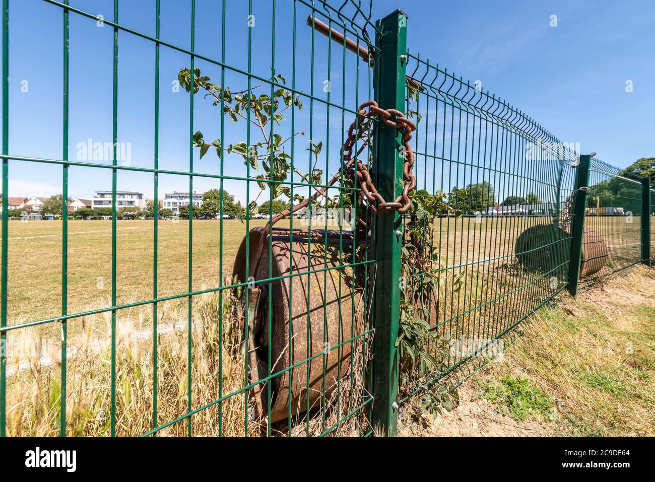 Chalkwell Park in Westcliff on Sea, Southend, Essex, UK. Southend on Sea Borough Council green space in an urban area.Cricket pitch rollers chained up Stock Photo